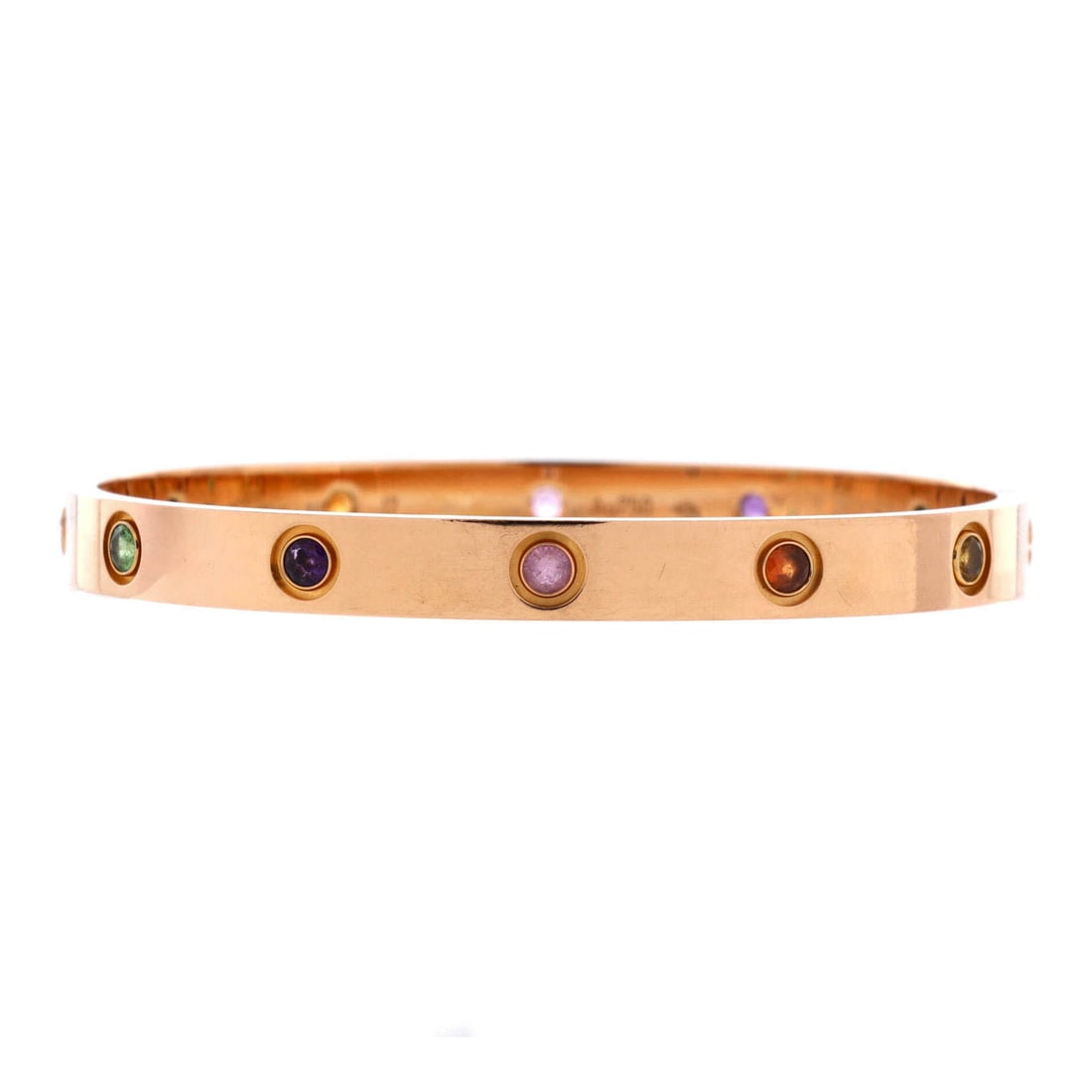 Cartier Love 10 Stone Bracelet 18K Rose Gold with Garnet, Amethyst and Sapphire: Stack-ready, the Cartier Love 10 Stone Bracelet holds its line with the disciplined geometry of a house signature. Worked in 18K Rose Gold with Garnet, Amethyst and Sapphire. Its band proportion reads