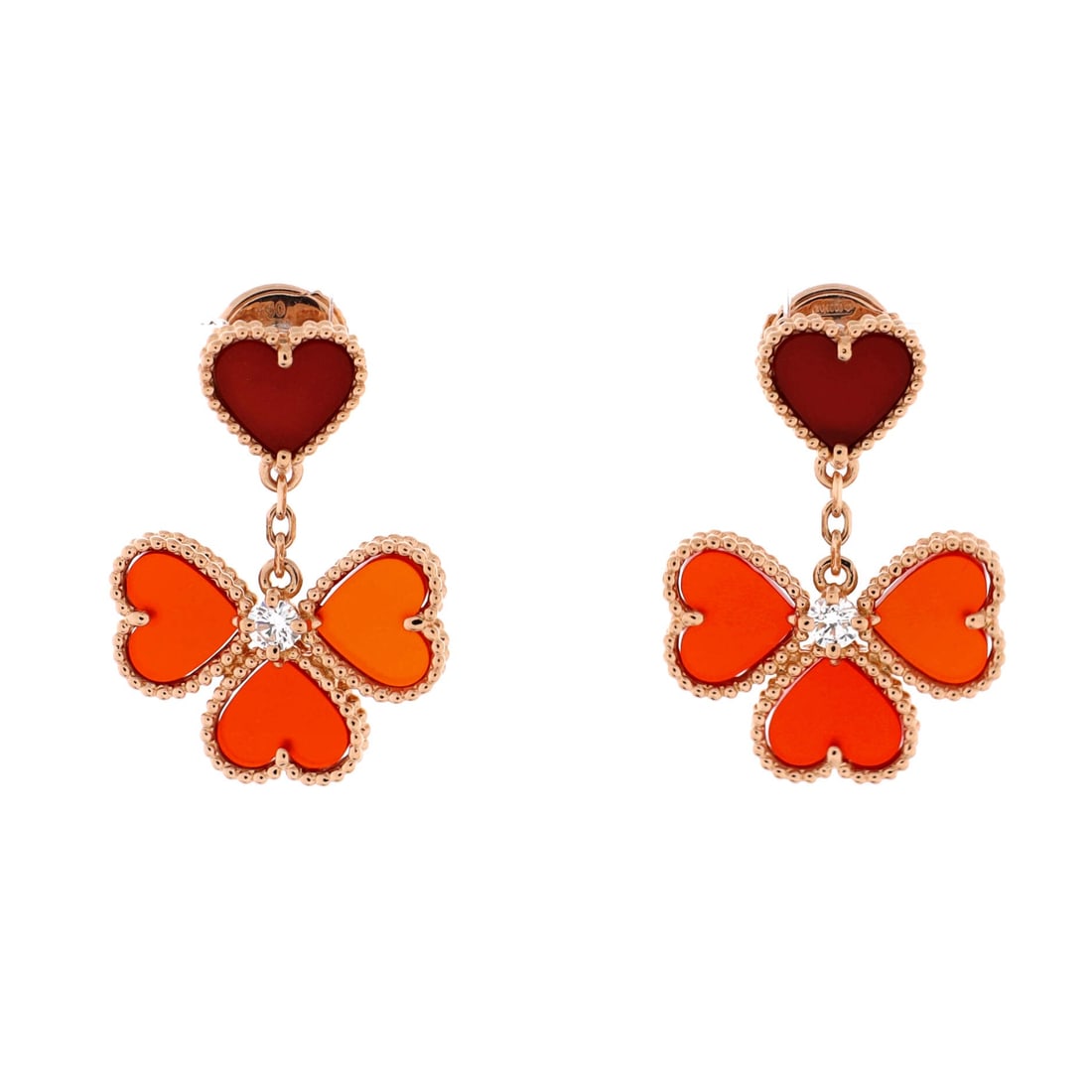 Van Cleef & Arpels Sweet Alhambra Effeuillage Heart Earrings: Drawn in rose gold, the Van Cleef & Arpels Sweet Alhambra Effeuillage Heart Earrings reads with a precise, editorial poise. Worked in 18K Rose Gold with Carnelian and Diamonds. Sized at 1 by 0.7 inche
