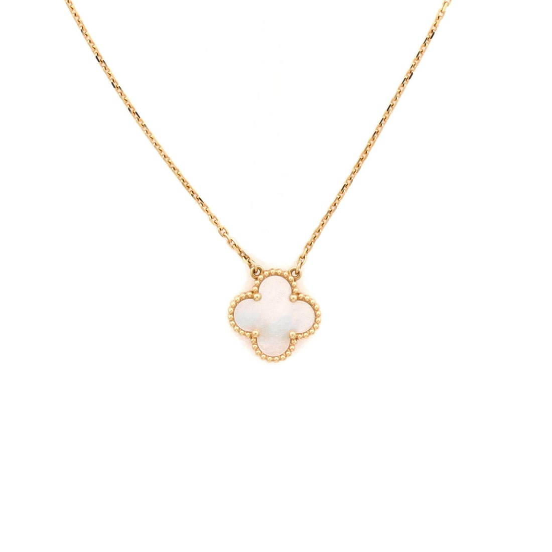 Van Cleef & Arpels Vintage Alhambra Pendant Necklace 18K Yellow Gold and Mother of Pearl: Anchored in poise, the Van Cleef & Arpels Vintage Alhambra Pendant Necklace layers chain and ornament with deliberate restraint. Worked in 18K Yellow Gold and Mother of Pearl. The chain length reads a