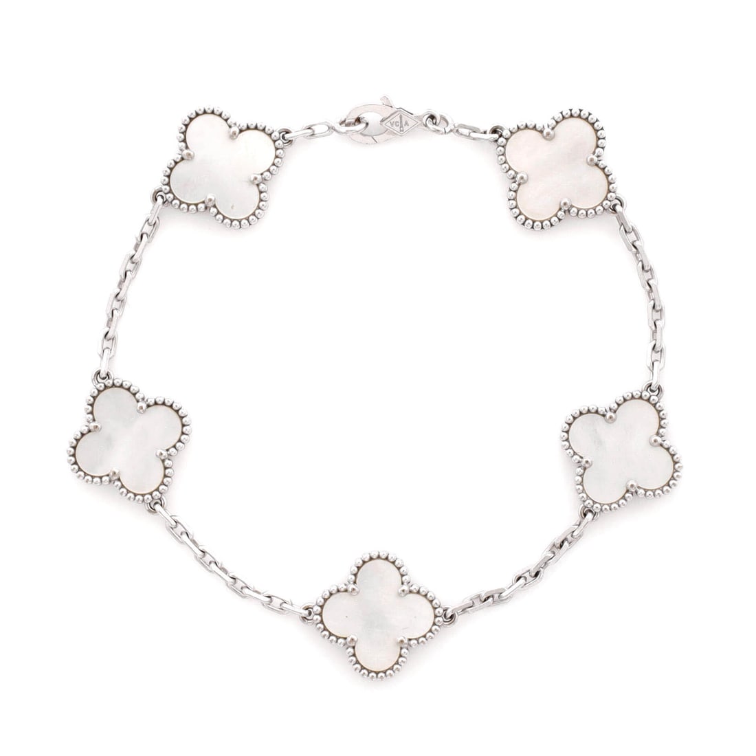 Van Cleef & Arpels Vintage Alhambra 5 Motifs Bracelet 18K White Gold and Mother of Pearl: Polished in white gold, the Van Cleef & Arpels Vintage Alhambra 5 Motifs Bracelet pairs a controlled silhouette with the supple movement of a well-built bangle. Worked in 18K White Gold and Mother of 