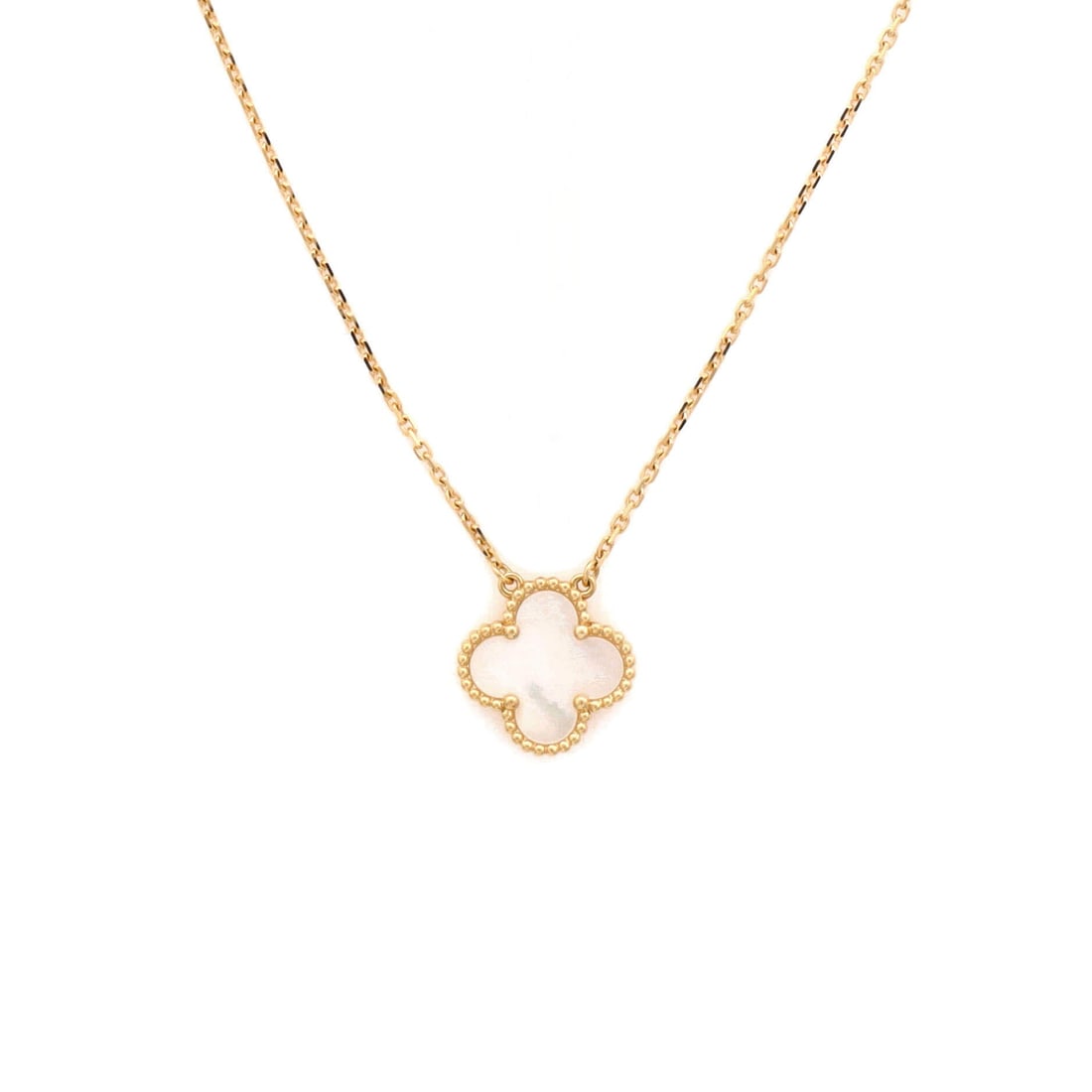 Van Cleef & Arpels Vintage Alhambra Pendant Necklace 18K Yellow Gold and Mother of Pearl: Drawn in yellow gold, the Van Cleef & Arpels Vintage Alhambra Pendant Necklace reads as both ornament and quiet emblem. Worked in 18K Yellow Gold and Mother of Pearl. Its proportions slip cleanly unde