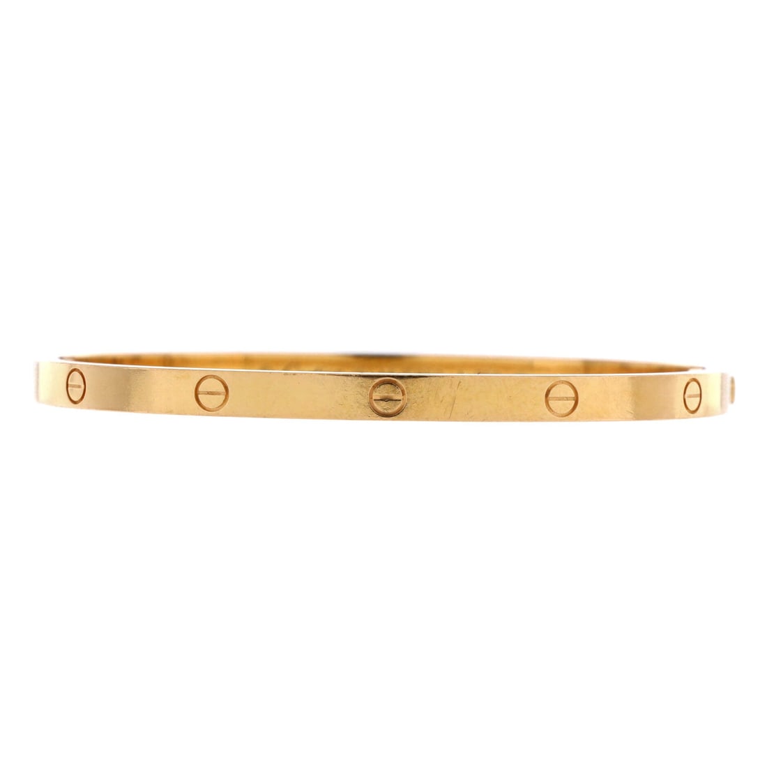 Cartier Love Bracelet 18K Yellow Gold Small: Wrist-tuned, the Cartier Love Bracelet balances visual weight against an easy, everyday fit. Worked in 18K Yellow Gold. The articulation traces the wrist closely, so it lays flat rather than rolling. 