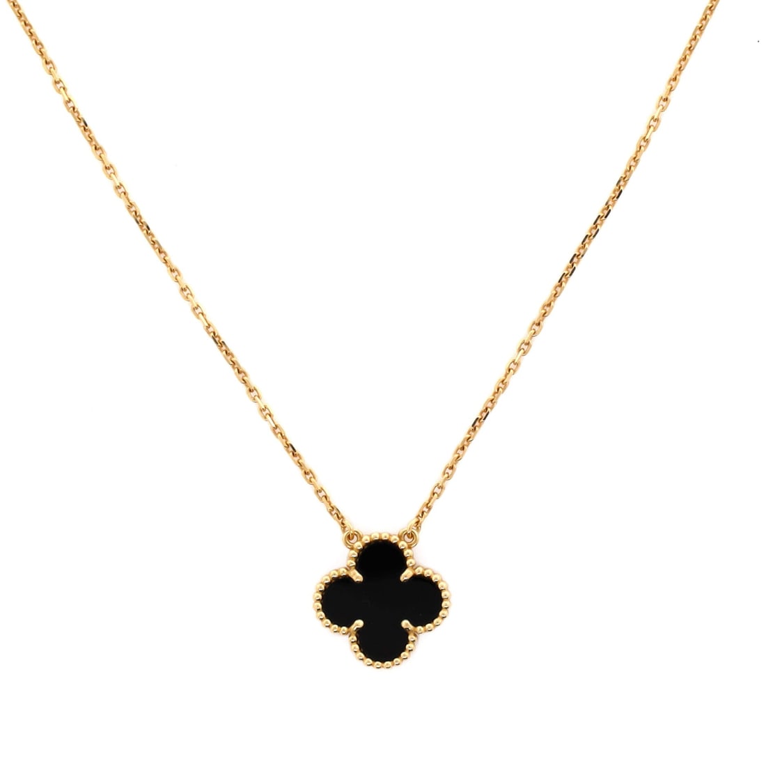 Van Cleef & Arpels Vintage Alhambra Pendant Necklace 18K Yellow Gold and Onyx: Presented in yellow gold, the Van Cleef & Arpels Vintage Alhambra Pendant Necklace sits with elegant intent against the collarbone. Worked in 18K Yellow Gold and Onyx. The drop sits exactly at the spo