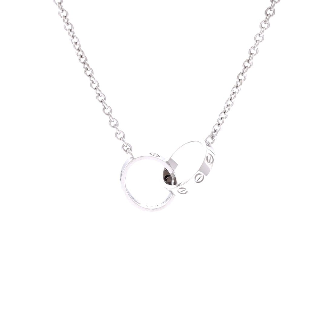 Cartier Love Interlocking Necklace 18K White Gold: Presented in white gold, the Cartier Love Interlocking Necklace balances proportion with a piece-of-jewelry confidence. Worked in 18K White Gold. Its proportions slip cleanly under a collar yet read d