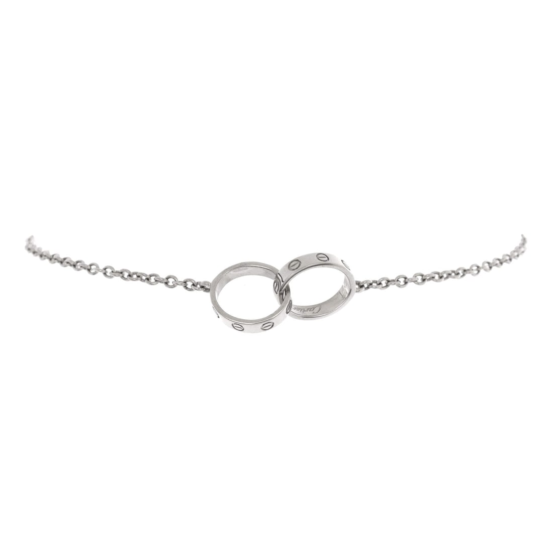 Cartier Love Interlocking Bracelet 18K White Gold: Cast in white gold, the Cartier Love Interlocking Bracelet sits as low-profile as it does deliberate. Worked in 18K White Gold. The articulation traces the wrist closely, so it lays flat rather than r
