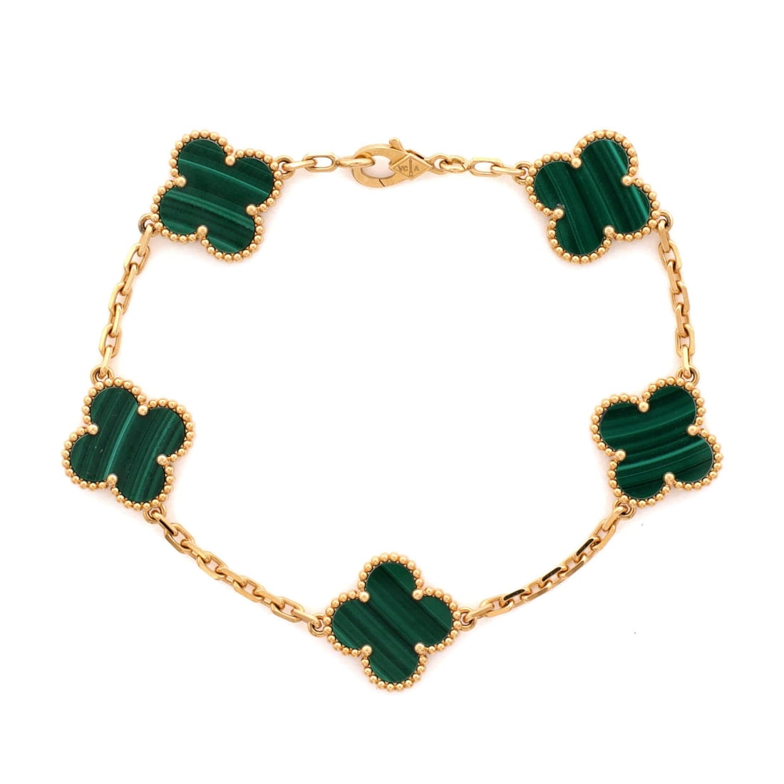 Van Cleef & Arpels Vintage Alhambra 5 Motifs Bracelet 18K Yellow Gold and Malachite: Hugging the wrist, the Van Cleef & Arpels Vintage Alhambra 5 Motifs Bracelet brings considered proportion to a forearm-anchoring statement. Worked in 18K Yellow Gold and Malachite. Its band proportion