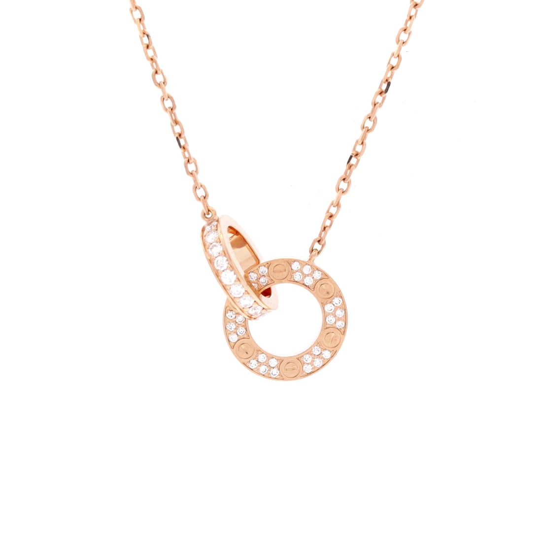 Cartier Love Interlocking Pave Necklace 18K Rose Gold and Diamonds: Presented in rose gold, the Cartier Love Interlocking Pave Necklace balances proportion with a piece-of-jewelry confidence. Worked in 18K Rose Gold and Diamonds. Its proportions slip cleanly under a c