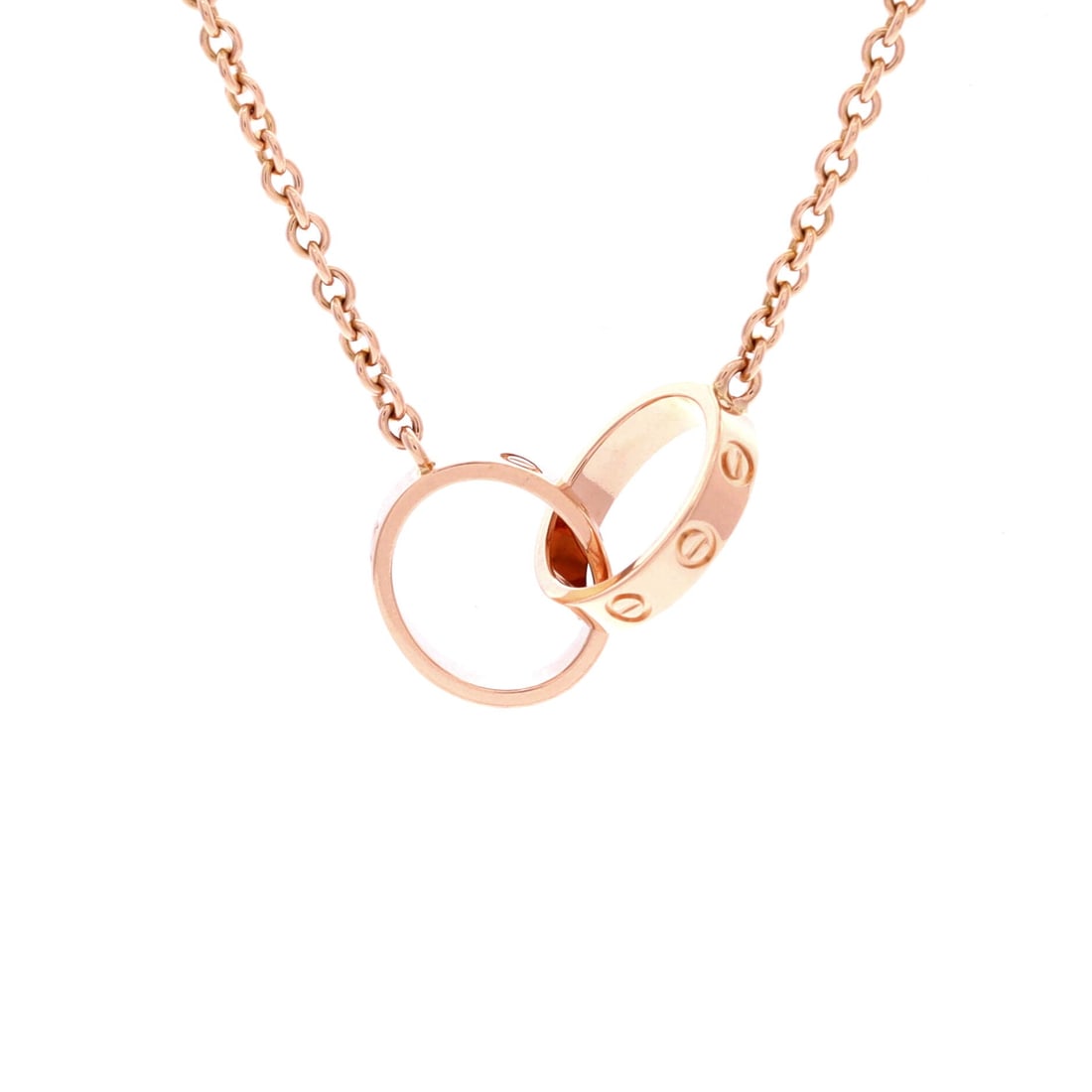 Cartier Love Interlocking Necklace 18K Rose Gold: Polished cleanly, the Cartier Love Interlocking Necklace sits with elegant intent against the collarbone. Worked in 18K Rose Gold. The chain length reads as classic mid-collar, where a piece announces