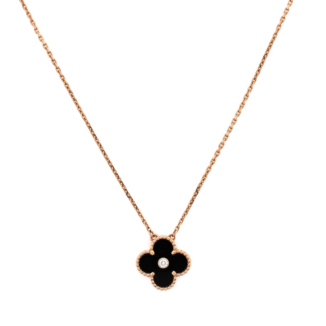 Van Cleef & Arpels Vintage Alhambra Pendant Necklace 18K Rose Gold and Onyx with Diamond: Polished cleanly, the Van Cleef & Arpels Vintage Alhambra Pendant Necklace positions its centerpiece exactly where the eye lands first. Worked in 18K Rose Gold and Onyx with Diamond. The drop sits exa
