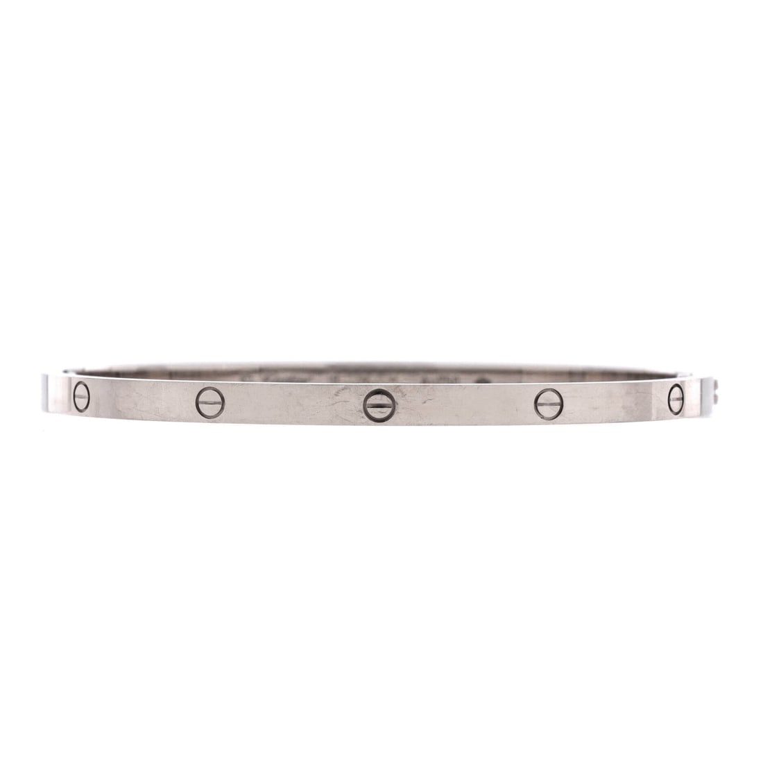 Cartier Love Bracelet 18K White Gold Small: Cast in white gold, the Cartier Love Bracelet reads as a daily-wear classic. Worked in 18K White Gold. The wrist fit is tuned for daily wear, easy to slide on without overpowering an everyday cuff or 