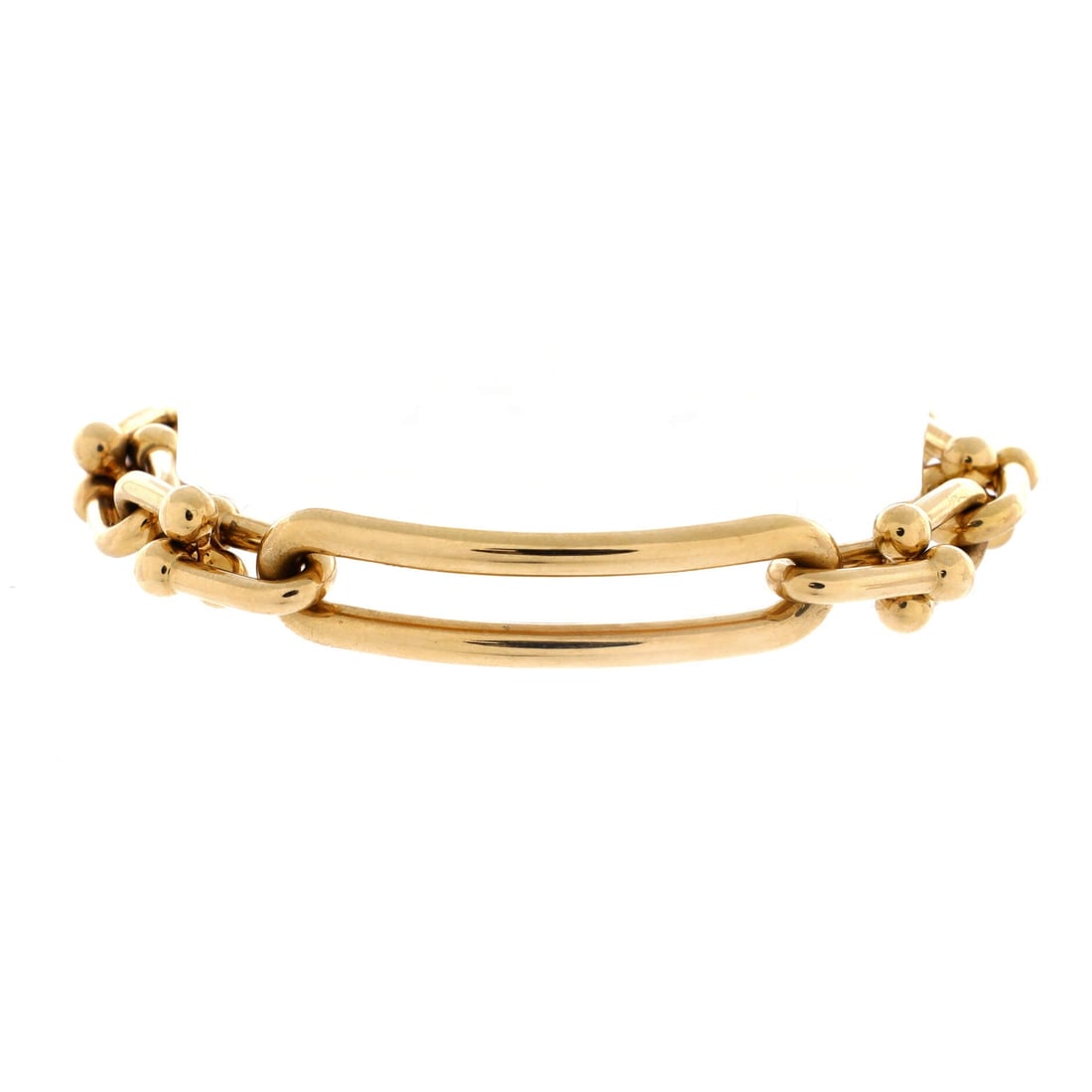 Tiffany & Co. Hardwear Elongated Link Bracelet 18K Yellow Gold: Hugging the wrist, the Tiffany & Co. Hardwear Elongated Link Bracelet sits as low-profile as it does deliberate. Worked in 18K Yellow Gold. The articulation traces the wrist closely, so it lays flat r