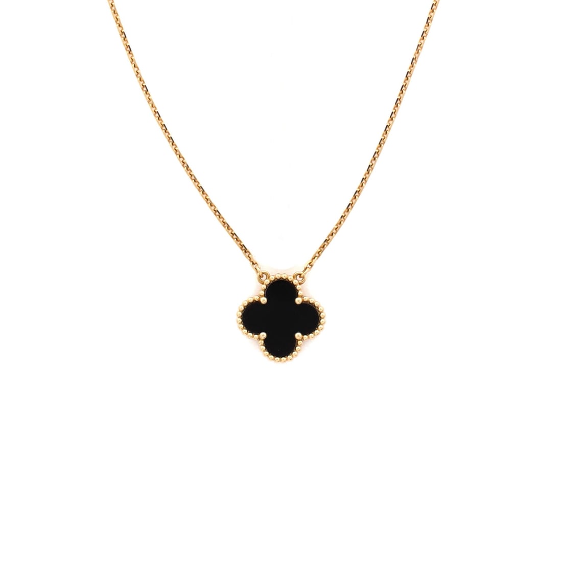 Van Cleef & Arpels Vintage Alhambra Pendant Necklace 18K Yellow Gold and Onyx: Polished cleanly, the Van Cleef & Arpels Vintage Alhambra Pendant Necklace pulls focus to the collarbone with composed restraint. Worked in 18K Yellow Gold and Onyx. Scale-wise it lives in the sweet s