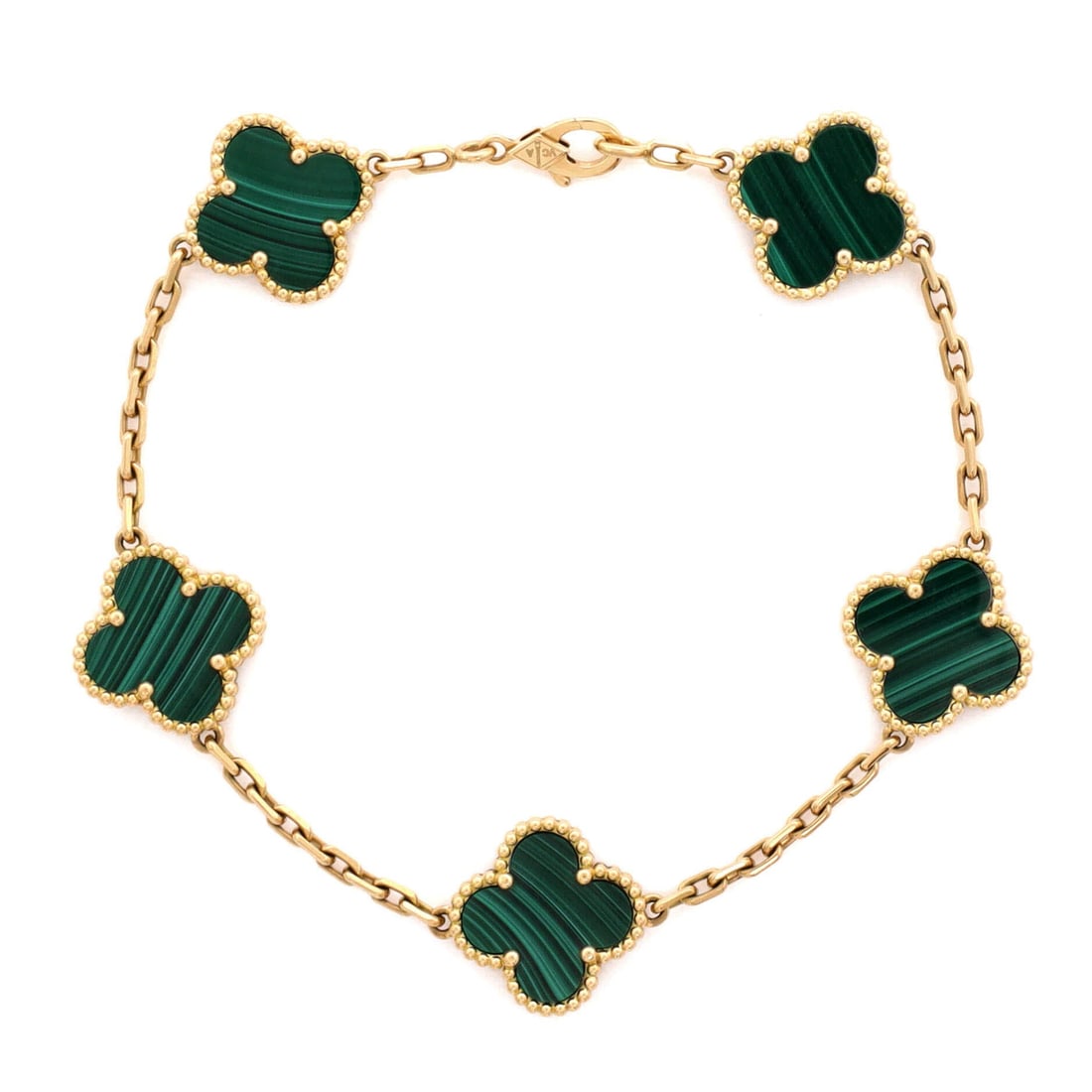 Van Cleef & Arpels Vintage Alhambra 5 Motifs Bracelet 18K Yellow Gold and Malachite: Worked in polished metal, the Van Cleef & Arpels Vintage Alhambra 5 Motifs Bracelet balances visual weight against an easy, everyday fit. Worked in 18K Yellow Gold and Malachite. The articulation trac