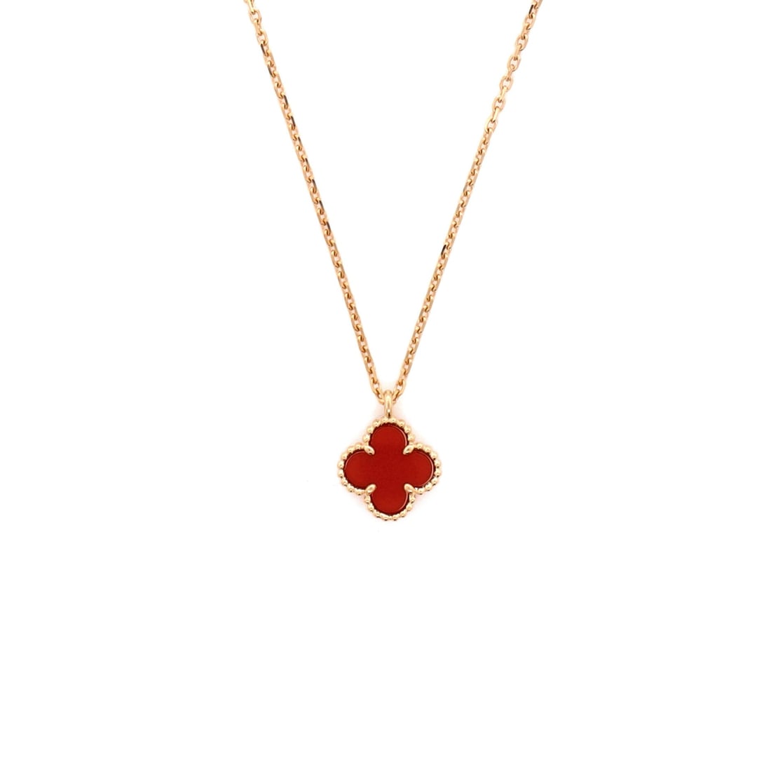Van Cleef & Arpels Sweet Alhambra Pendant Necklace 18K Rose Gold and Carnelian: Set in rose gold, the Van Cleef & Arpels Sweet Alhambra Pendant Necklace positions its centerpiece exactly where the eye lands first. Worked in 18K Rose Gold and Carnelian. The chain length reads as c