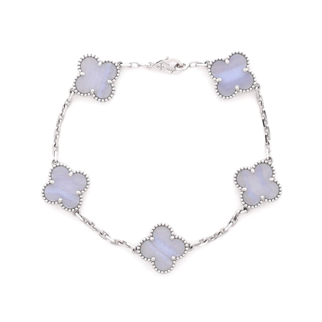 Van Cleef & Arpels Vintage Alhambra 5 Motifs Bracelet 18K White Gold and Chalcedony: Stack-ready, the Van Cleef & Arpels Vintage Alhambra 5 Motifs Bracelet holds its line with the disciplined geometry of a house signature. Worked in 18K White Gold and Chalcedony. Its band proportion r