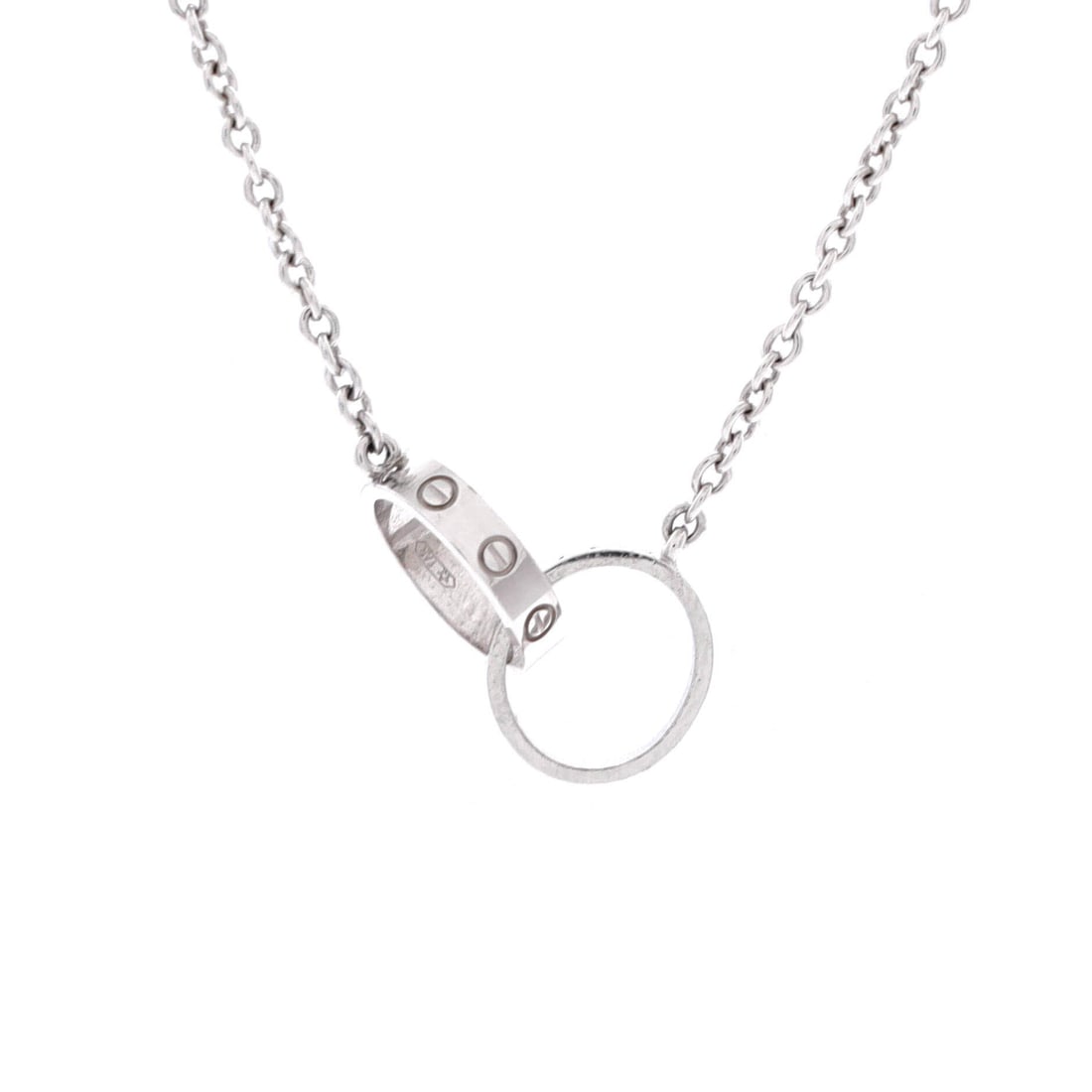Cartier Love Interlocking Necklace 18K White Gold: Linked with care, the Cartier Love Interlocking Necklace pulls focus to the collarbone with composed restraint. Worked in 18K White Gold. Its proportions slip cleanly under a collar yet read distinctl