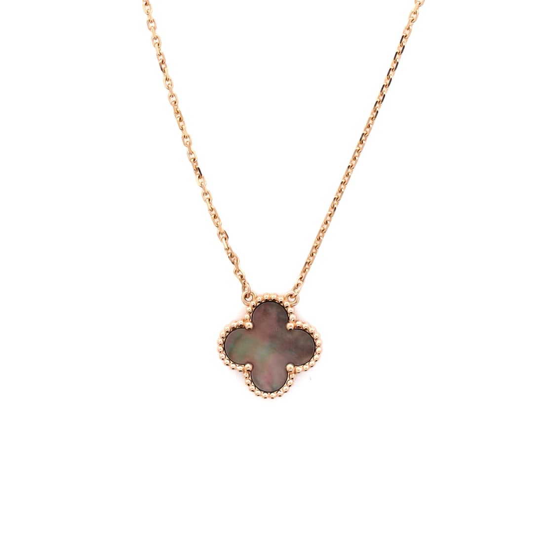 Van Cleef & Arpels Vintage Alhambra Pendant Necklace 18K Rose Gold and Grey Mother of Pearl: Presented in rose gold, the Van Cleef & Arpels Vintage Alhambra Pendant Necklace threads its motif from clasp to charm with a single fluent gesture. Worked in 18K Rose Gold and Grey Mother of Pearl. S