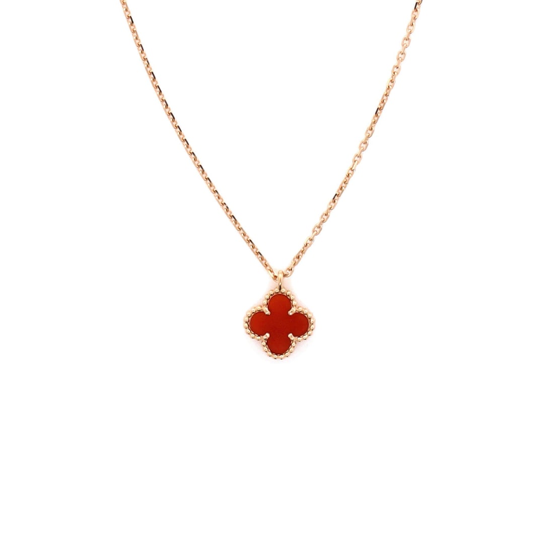 Van Cleef & Arpels Sweet Alhambra Pendant Necklace 18K Rose Gold and Carnelian: Threaded in rose gold, the Van Cleef & Arpels Sweet Alhambra Pendant Necklace reads with the kind of clean line that holds attention without raising its voice. Worked in 18K Rose Gold and Carnelian. S