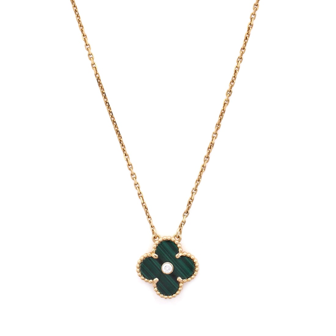 Van Cleef & Arpels Vintage Alhambra Pendant Necklace 18K Yellow Gold and Malachite with Diamond: Editorial-calm, the Van Cleef & Arpels Vintage Alhambra Pendant Necklace reads with the kind of clean line that holds attention without raising its voice. Worked in 18K Yellow Gold and Malachite with 