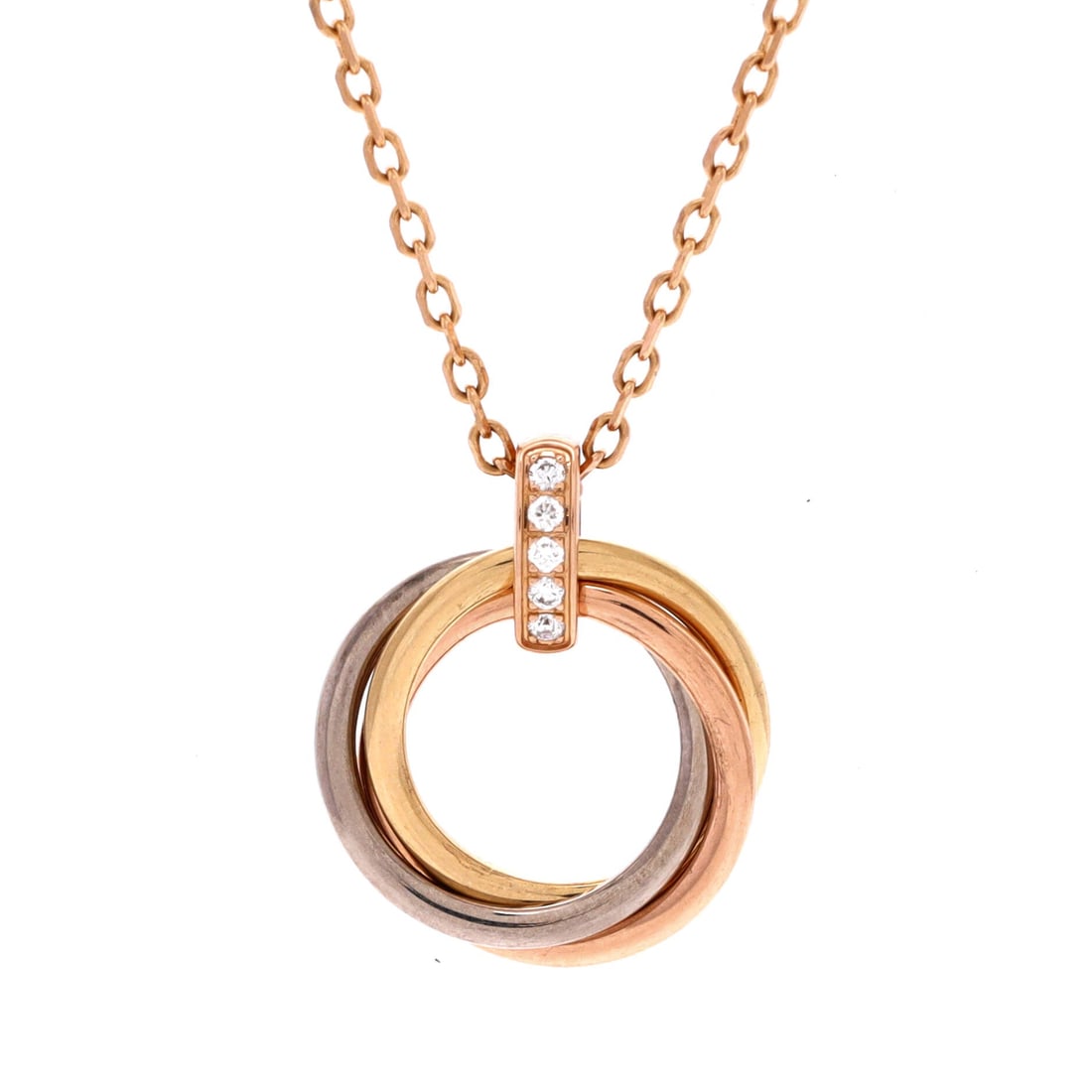 Cartier Trinity Pendant Necklace 18K Tricolor Gold and Diamonds: Cast in tricolor gold, the Cartier Trinity Pendant Necklace pulls focus to the collarbone with composed restraint. Worked in 18K Tricolor Gold and Diamonds. Its proportions slip cleanly under a collar