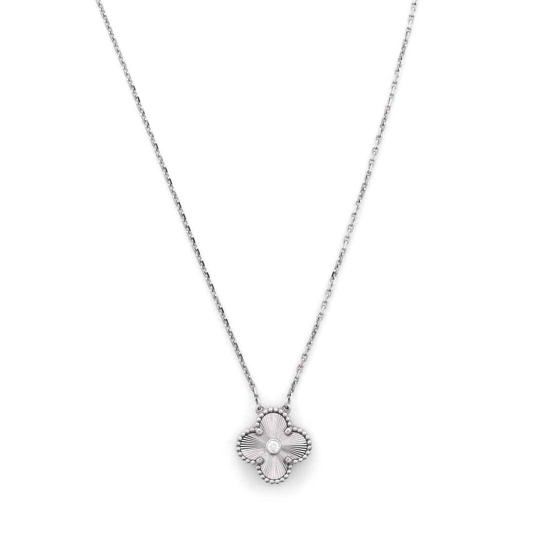 Van Cleef & Arpels Vintage Alhambra Pendant Necklace Guilloche 18K White Gold with Diamond: Polished cleanly, the Van Cleef & Arpels Vintage Alhambra Pendant Necklace positions its centerpiece exactly where the eye lands first. Worked in Guilloche 18K White Gold with Diamond. The drop sits e