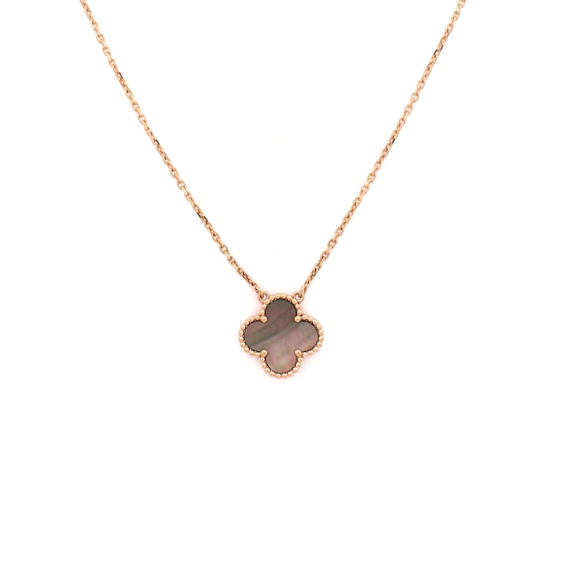 Van Cleef & Arpels Vintage Alhambra Pendant Necklace 18K Rose Gold and Grey Mother of Pearl: Anchored in rose gold, the Van Cleef & Arpels Vintage Alhambra Pendant Necklace reads with the kind of clean line that holds attention without raising its voice. Worked in 18K Rose Gold and Grey Mothe