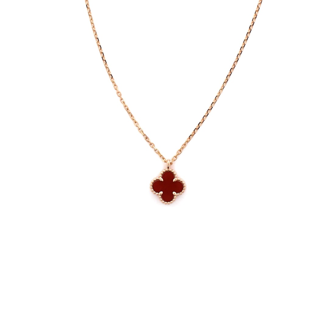 Van Cleef & Arpels Sweet Alhambra Pendant Necklace 18K Rose Gold and Carnelian: Anchored in rose gold, the Van Cleef & Arpels Sweet Alhambra Pendant Necklace carries its motif with quiet authority. Worked in 18K Rose Gold and Carnelian. The drop sits exactly at the spot a thought