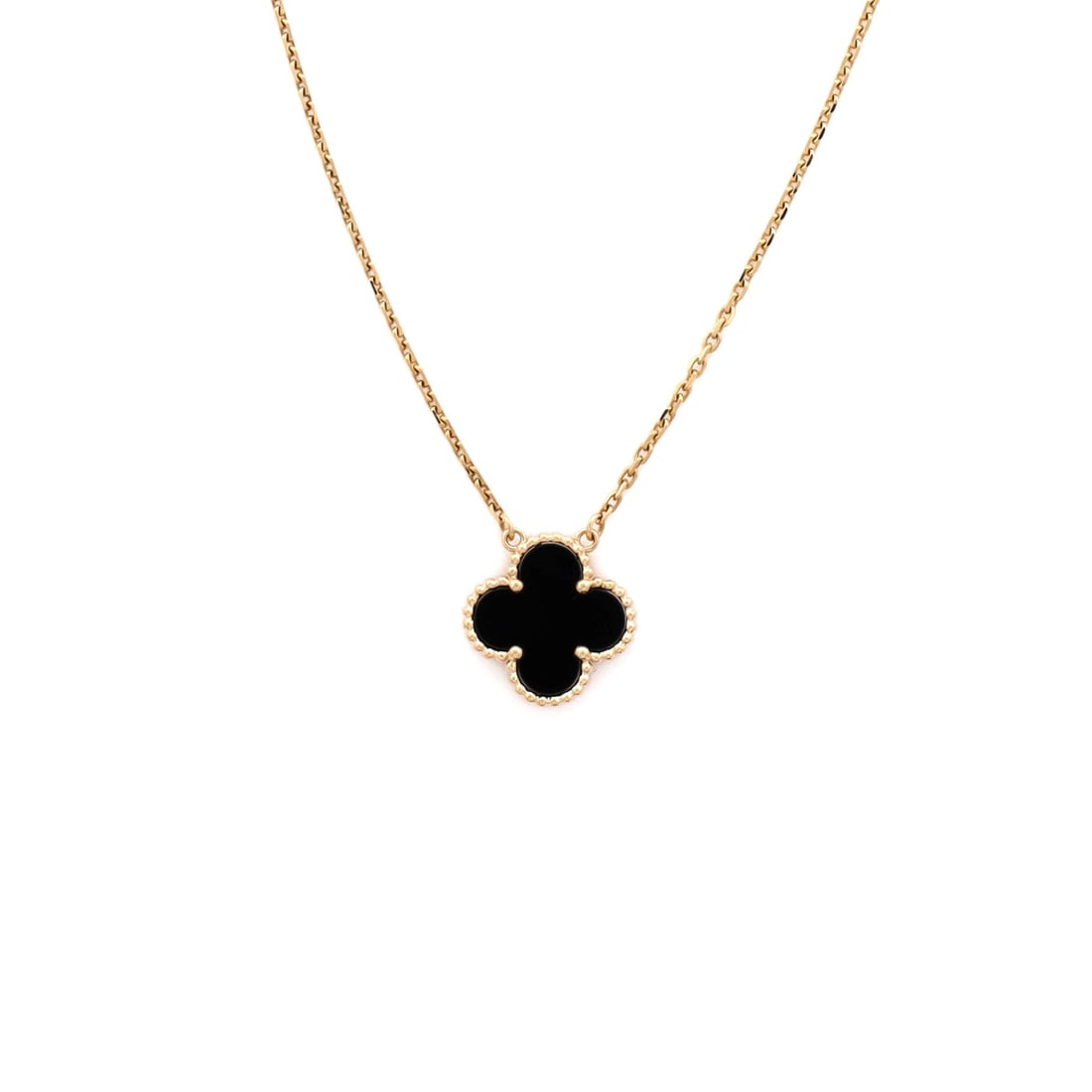 Van Cleef & Arpels Vintage Alhambra Pendant Necklace 18K Yellow Gold and Onyx: Drawn in polished metal, the Van Cleef & Arpels Vintage Alhambra Pendant Necklace layers chain and ornament with deliberate restraint. Worked in 18K Yellow Gold and Onyx. The chain length reads as cla