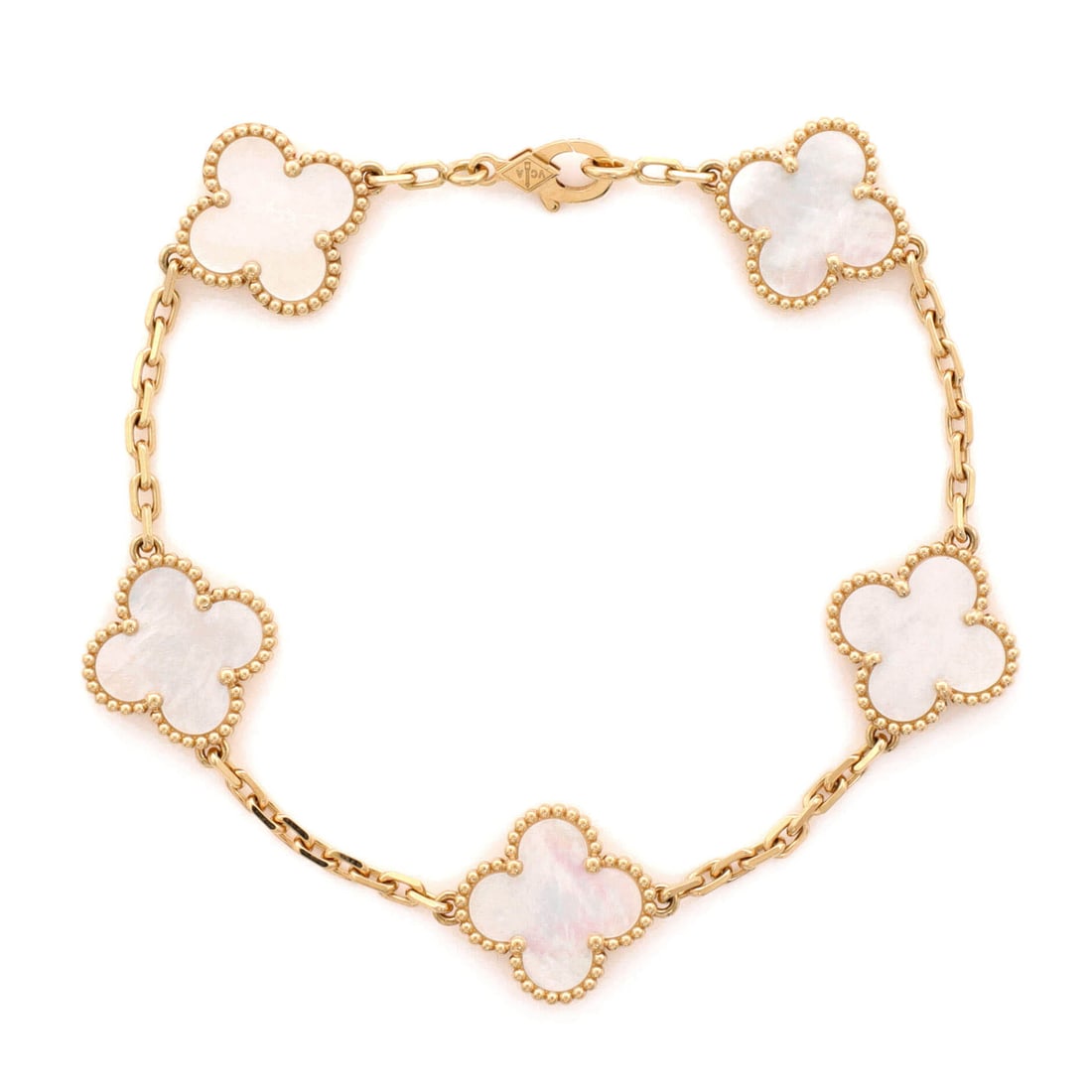 Van Cleef & Arpels Vintage Alhambra 5 Motifs Bracelet 18K Yellow Gold and Mother of Pearl: Hugging the wrist, the Van Cleef & Arpels Vintage Alhambra 5 Motifs Bracelet brings considered proportion to a forearm-anchoring statement. Worked in 18K Yellow Gold and Mother of Pearl. Its band prop