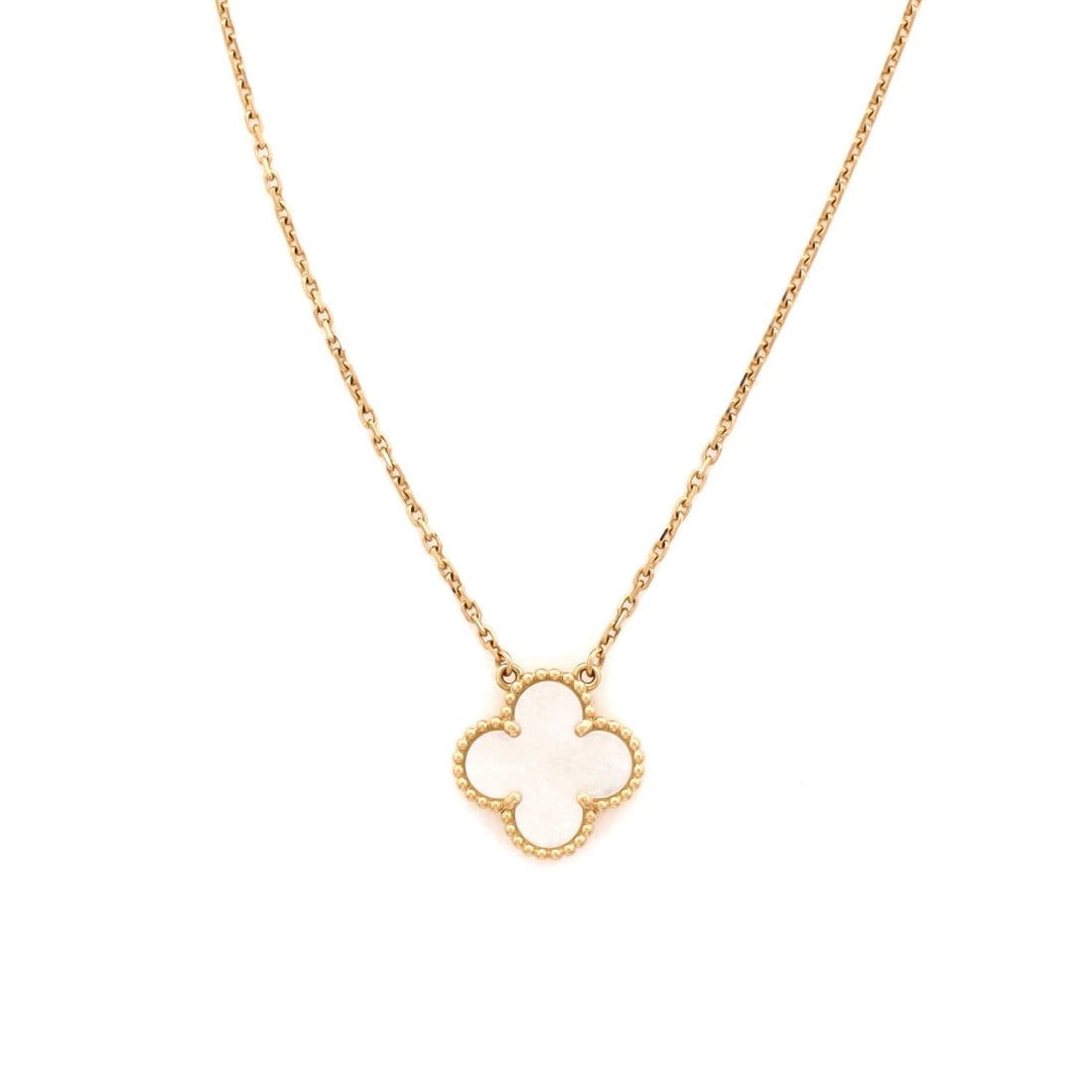 Van Cleef & Arpels Vintage Alhambra Pendant Necklace 18K Yellow Gold and Mother of Pearl: Anchored in yellow gold, the Van Cleef & Arpels Vintage Alhambra Pendant Necklace keeps its silhouette spare and its presence assured. Worked in 18K Yellow Gold and Mother of Pearl. Its proportions sl