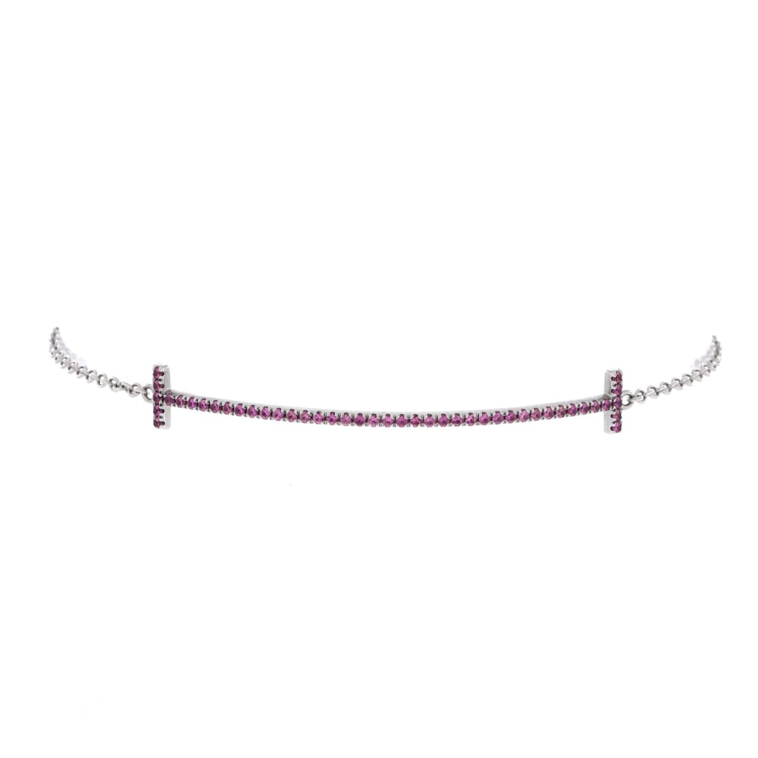 Tiffany & Co. T Smile Chain Bracelet 18K White Gold and Pink Sapphire Medium: Compact-linked, the Tiffany & Co. T Smile Chain Bracelet brings considered proportion to a forearm-anchoring statement. Worked in 18K White Gold and Pink Sapphire. Its band proportion reads as substan