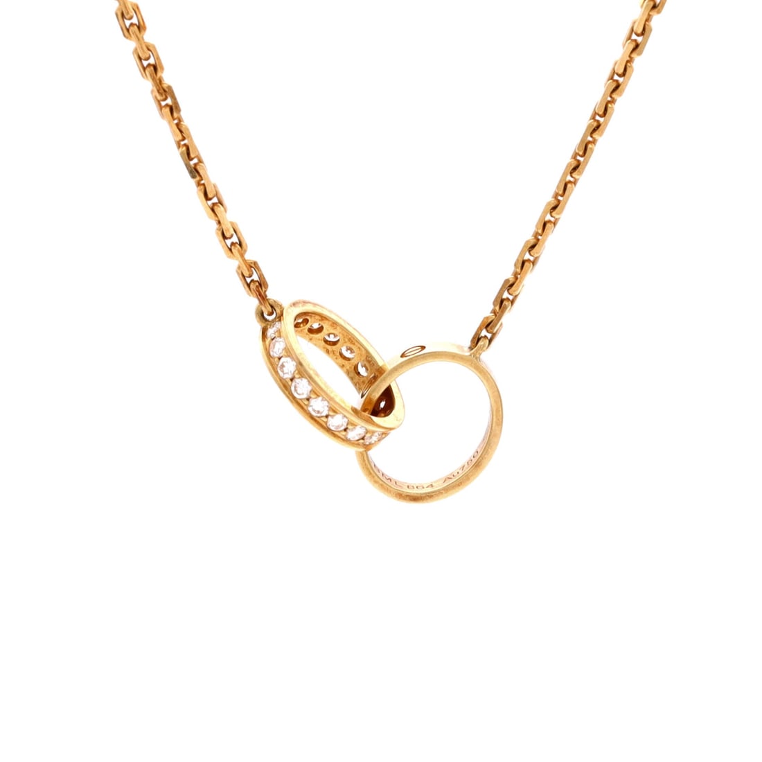 Cartier Love Interlocking Necklace 18K Yellow Gold and Diamonds: Drawn in yellow gold, the Cartier Love Interlocking Necklace reads with the kind of clean line that holds attention without raising its voice. Worked in 18K Yellow Gold and Diamonds. Scale-wise it liv
