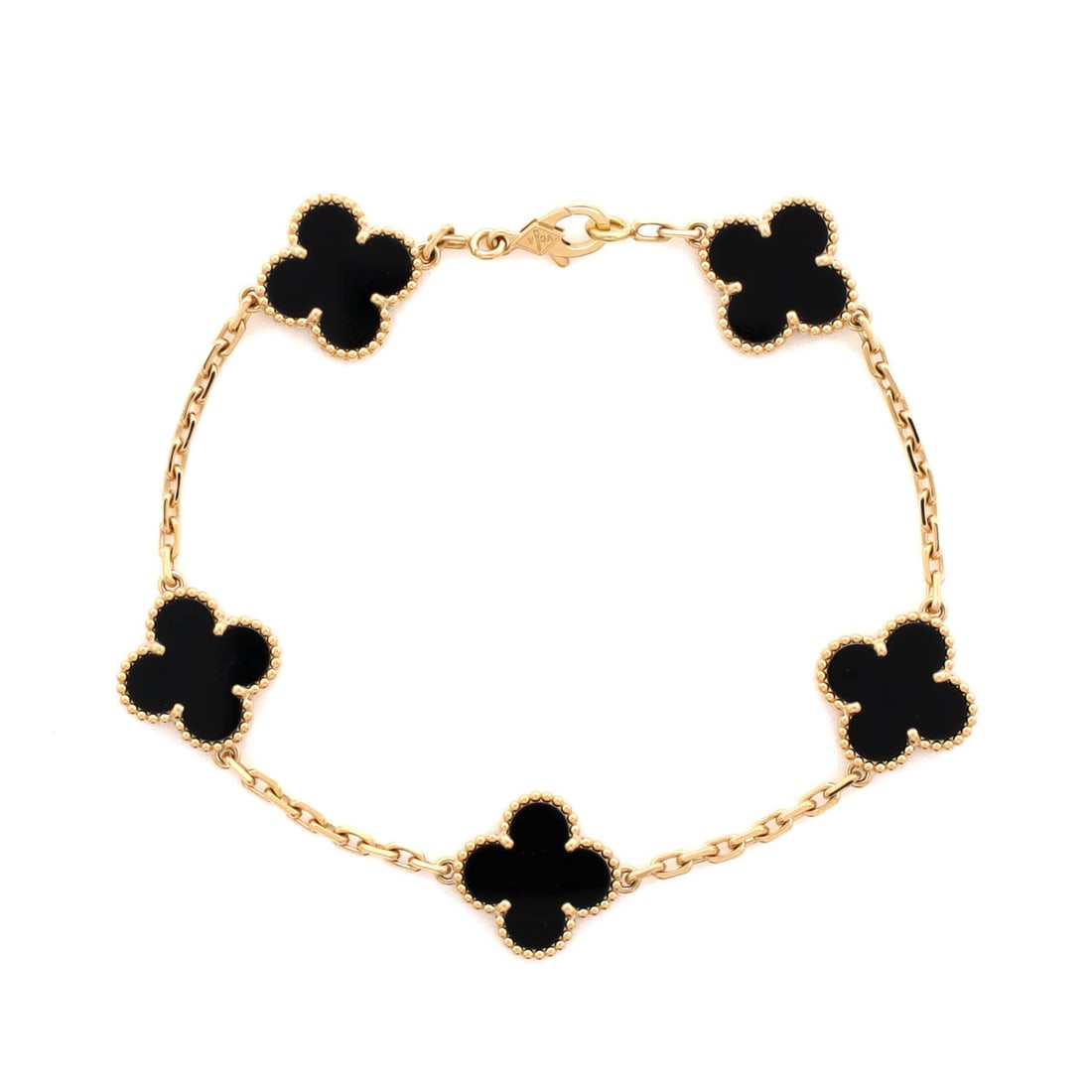 Van Cleef & Arpels Vintage Alhambra 5 Motifs Bracelet 18K Yellow Gold and Onyx: Articulation-first, the Van Cleef & Arpels Vintage Alhambra 5 Motifs Bracelet curves around the wrist scaled for daily wear without losing its presence. Worked in 18K Yellow Gold and Onyx. The articul