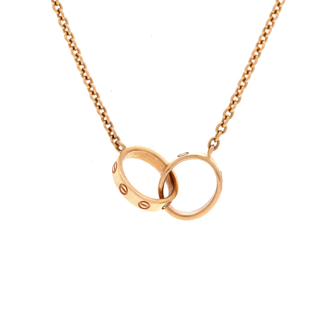 Cartier Love Interlocking Necklace 18K Rose Gold: Anchored in rose gold, the Cartier Love Interlocking Necklace carries its motif with quiet authority. Worked in 18K Rose Gold. The drop sits exactly at the spot a thoughtful piece is meant to land - l