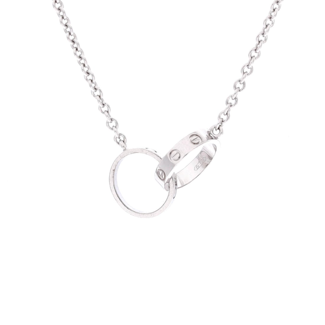 Cartier Love Interlocking Necklace 18K White Gold: Cast in white gold, the Cartier Love Interlocking Necklace positions its centerpiece exactly where the eye lands first. Worked in 18K White Gold. The chain length reads as classic mid-collar, where a 