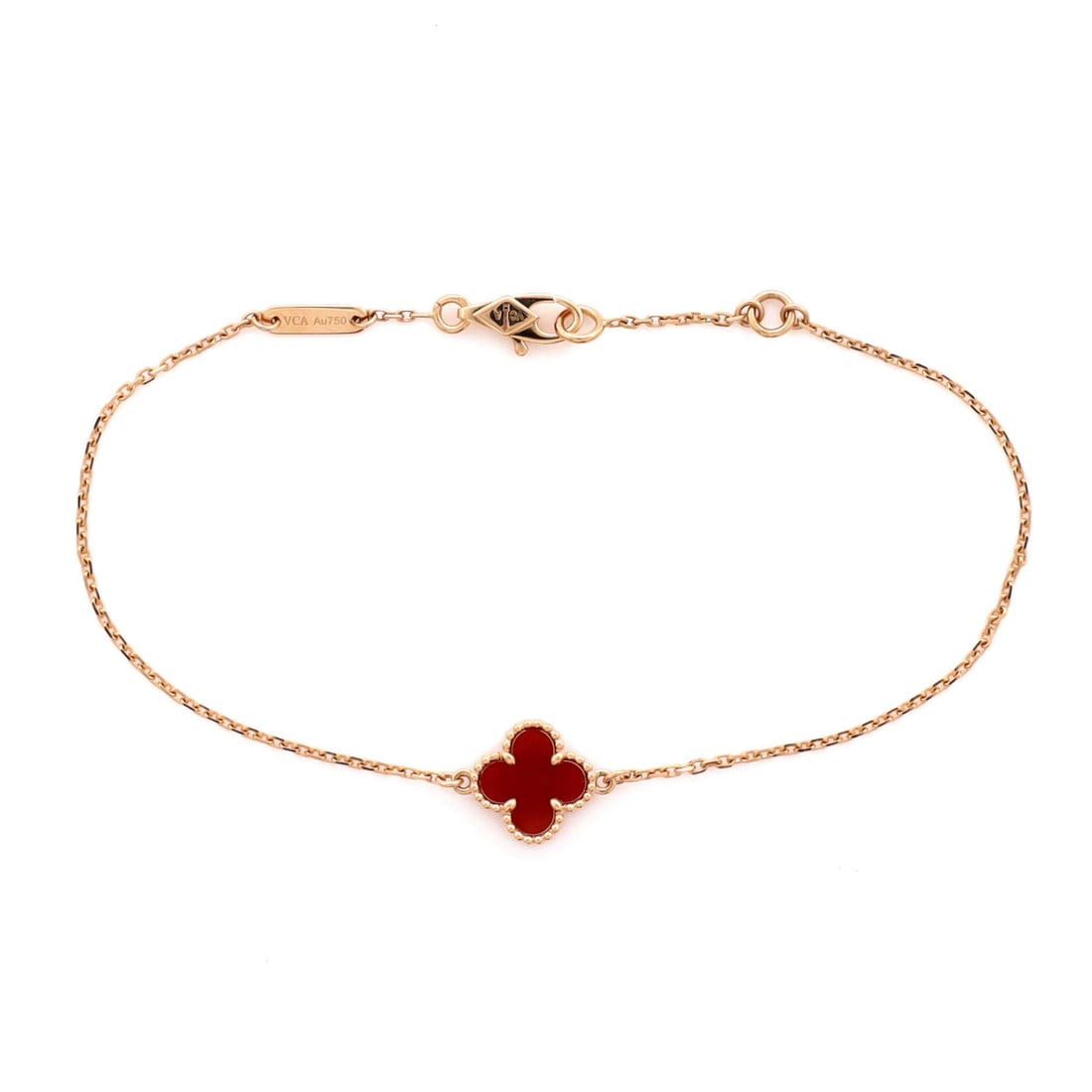 Van Cleef & Arpels Sweet Alhambra Bracelet 18K Rose Gold and Carnelian: Drawn in rose gold, the Van Cleef & Arpels Sweet Alhambra Bracelet pairs a controlled silhouette with the supple movement of a well-built bangle. Worked in 18K Rose Gold and Carnelian. The articulatio
