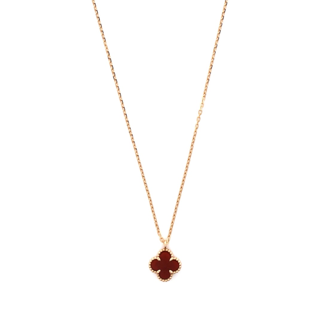 Van Cleef & Arpels Sweet Alhambra Pendant Necklace 18K Rose Gold and Carnelian: Built for the collarbone, the Van Cleef & Arpels Sweet Alhambra Pendant Necklace balances proportion with a piece-of-jewelry confidence. Worked in 18K Rose Gold and Carnelian. Its proportions slip cle
