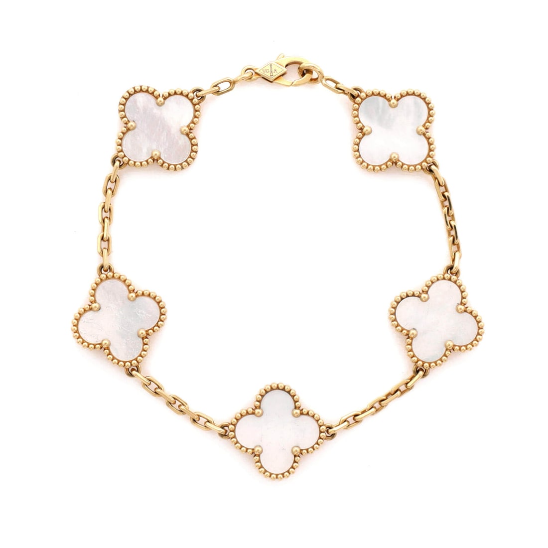 Van Cleef & Arpels Vintage Alhambra 5 Motifs Bracelet 18K Yellow Gold and Mother of Pearl: Daily-rotation ready, the Van Cleef & Arpels Vintage Alhambra 5 Motifs Bracelet carries motion across the wrist while keeping a refined profile. Worked in 18K Yellow Gold and Mother of Pearl. The wris