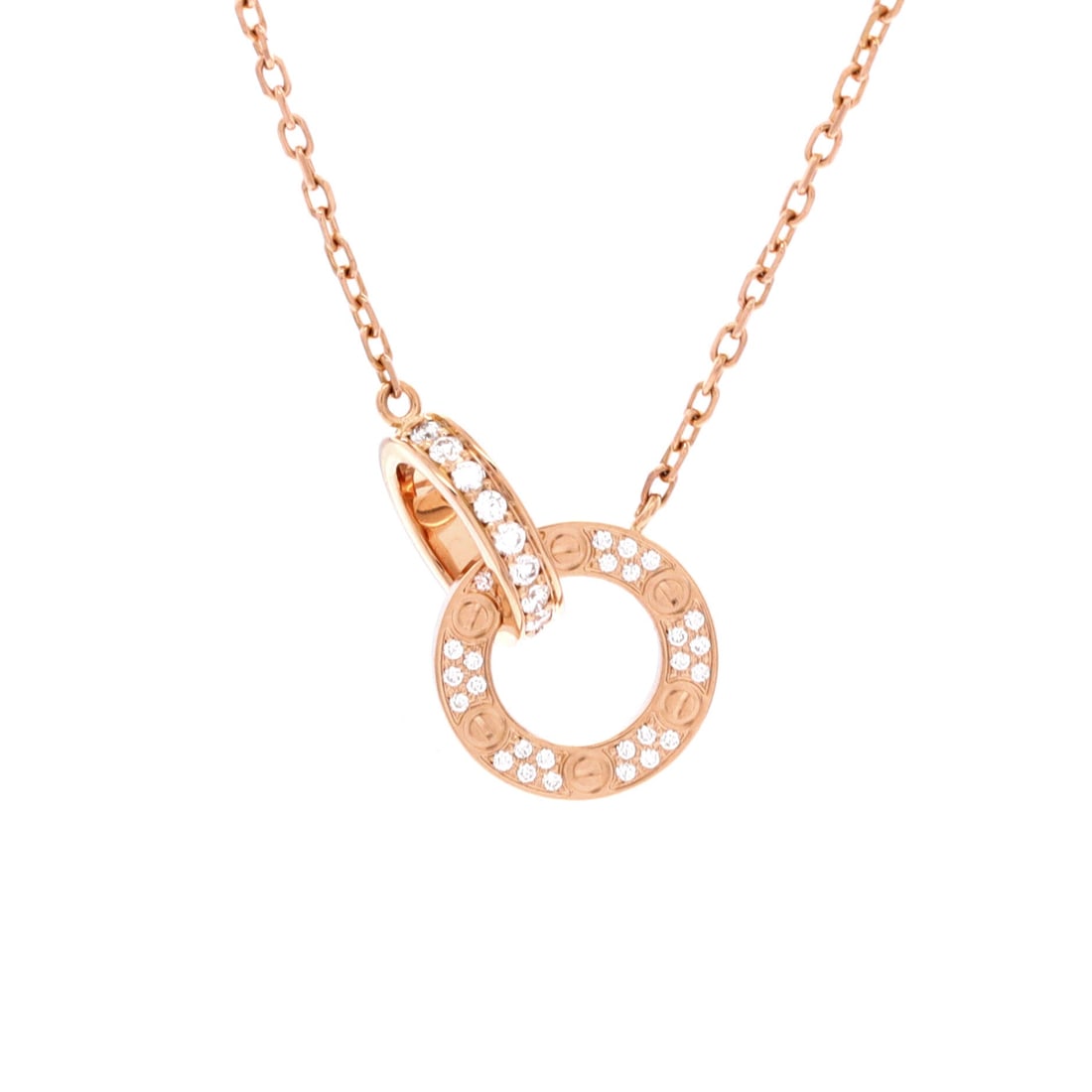 Cartier Love Interlocking Pave Necklace 18K Rose Gold and Diamonds: Anchored in rose gold, the Cartier Love Interlocking Pave Necklace carries its motif with quiet authority. Worked in 18K Rose Gold and Diamonds. The drop sits exactly at the spot a thoughtful piece is