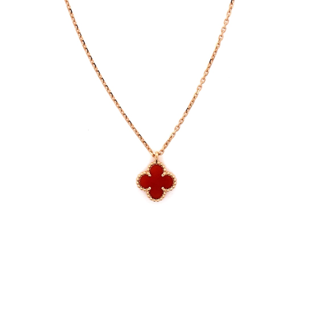Van Cleef & Arpels Sweet Alhambra Pendant Necklace 18K Rose Gold and Carnelian: Tuned to wear, the Van Cleef & Arpels Sweet Alhambra Pendant Necklace reads as both ornament and quiet emblem. Worked in 18K Rose Gold and Carnelian. The drop sits exactly at the spot a thoughtful pie