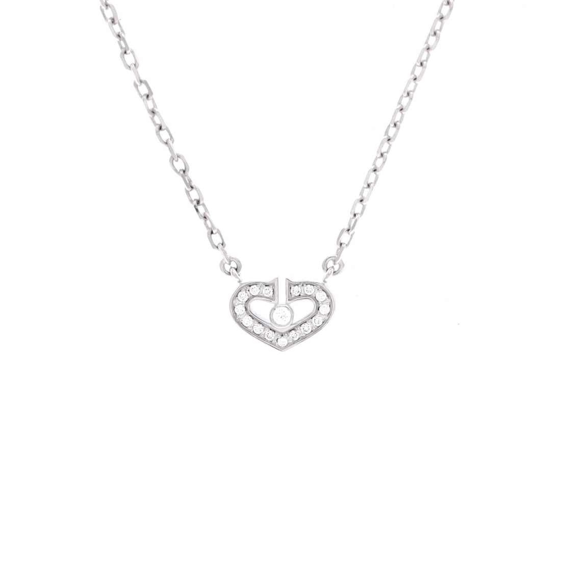 Cartier C Heart de Cartier Pendant Necklace 18K White Gold with Diamonds: Threaded in white gold, the Cartier C Heart de Cartier Pendant Necklace keeps its silhouette spare and its presence assured. Worked in 18K White Gold with Diamonds. Its proportions slip cleanly under 