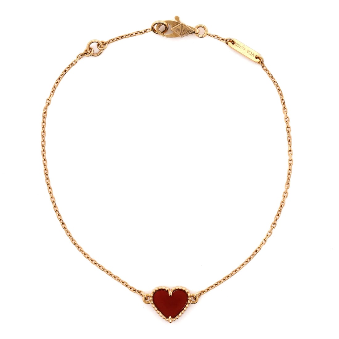 Van Cleef & Arpels Sweet Alhambra Heart Bracelet 18K Rose Gold with Carnelian: Sculpted in rose gold, the Van Cleef & Arpels Sweet Alhambra Heart Bracelet holds its line with the disciplined geometry of a house signature. Worked in 18K Rose Gold with Carnelian. Its band proporti