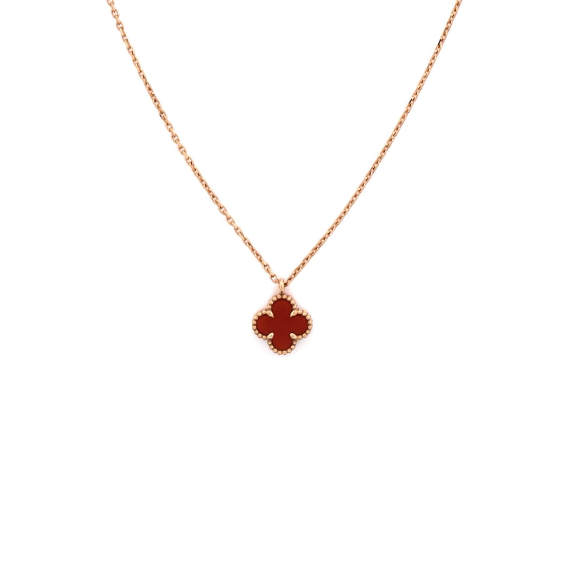 Van Cleef & Arpels Sweet Alhambra Pendant Necklace 18K Rose Gold and Carnelian: Cast in rose gold, the Van Cleef & Arpels Sweet Alhambra Pendant Necklace positions its centerpiece exactly where the eye lands first. Worked in 18K Rose Gold and Carnelian. The chain length reads as 