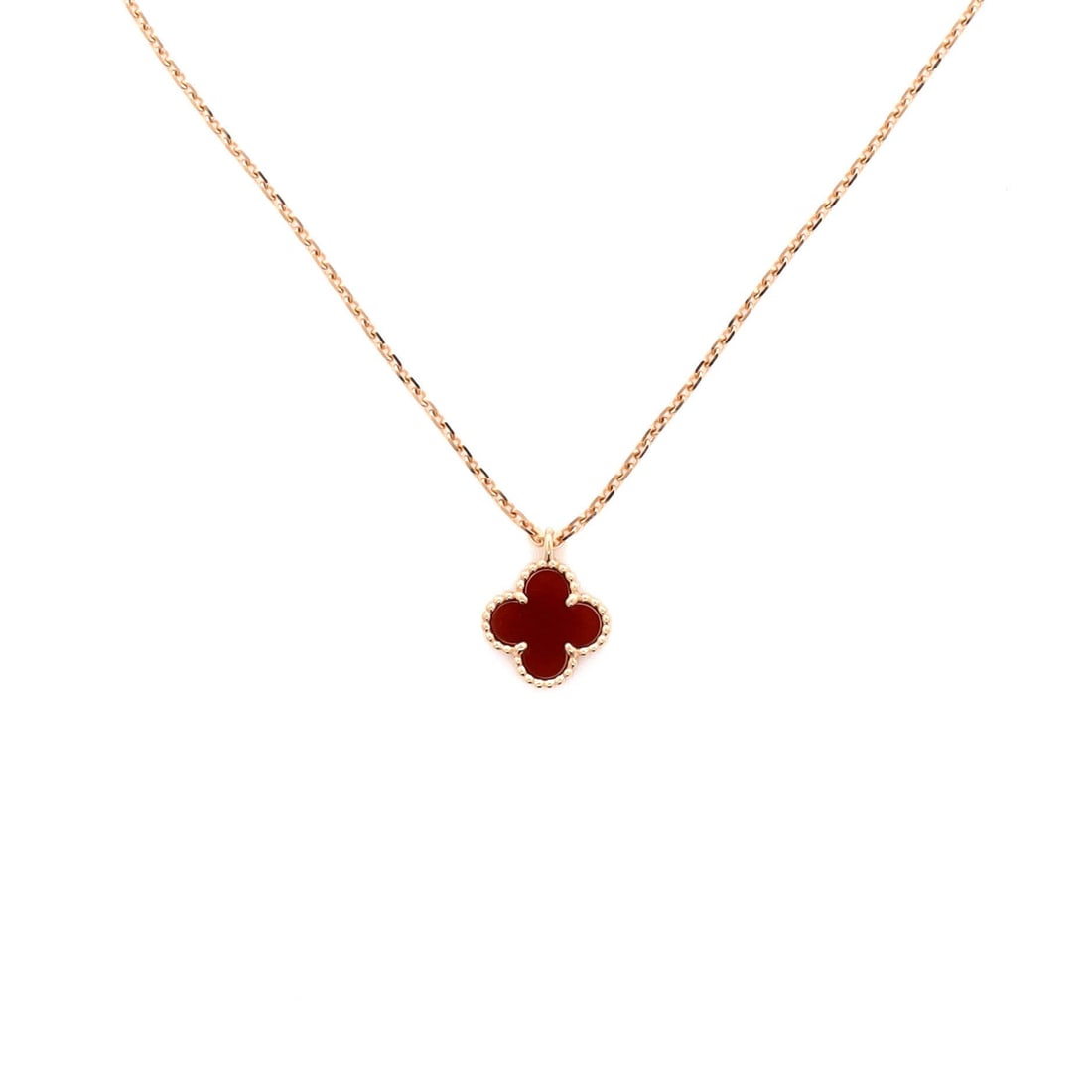 Van Cleef & Arpels Sweet Alhambra Pendant Necklace 18K Rose Gold and Carnelian: Quietly composed, the Van Cleef & Arpels Sweet Alhambra Pendant Necklace reads as both ornament and quiet emblem. Worked in 18K Rose Gold and Carnelian. The drop sits exactly at the spot a thoughtful 