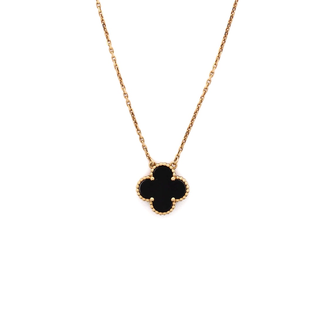 Van Cleef & Arpels Vintage Alhambra Pendant Necklace 18K Yellow Gold and Onyx: Anchored in poise, the Van Cleef & Arpels Vintage Alhambra Pendant Necklace reads as both ornament and quiet emblem. Worked in 18K Yellow Gold and Onyx. Its proportions slip cleanly under a collar yet