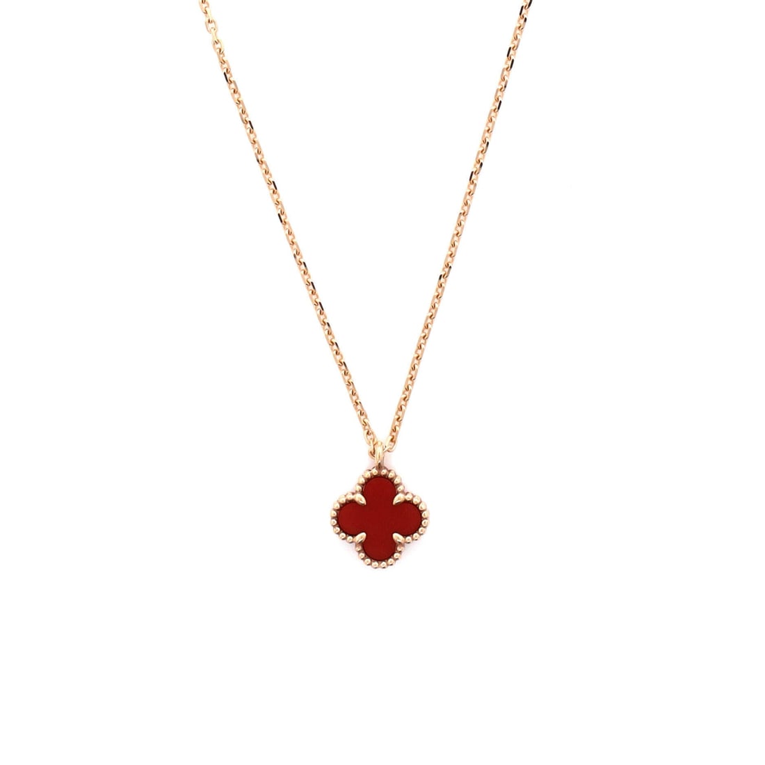 Van Cleef & Arpels Sweet Alhambra Pendant Necklace 18K Rose Gold and Carnelian: Tuned to wear, the Van Cleef & Arpels Sweet Alhambra Pendant Necklace reads as both ornament and quiet emblem. Worked in 18K Rose Gold and Carnelian. The drop sits exactly at the spot a thoughtful pie