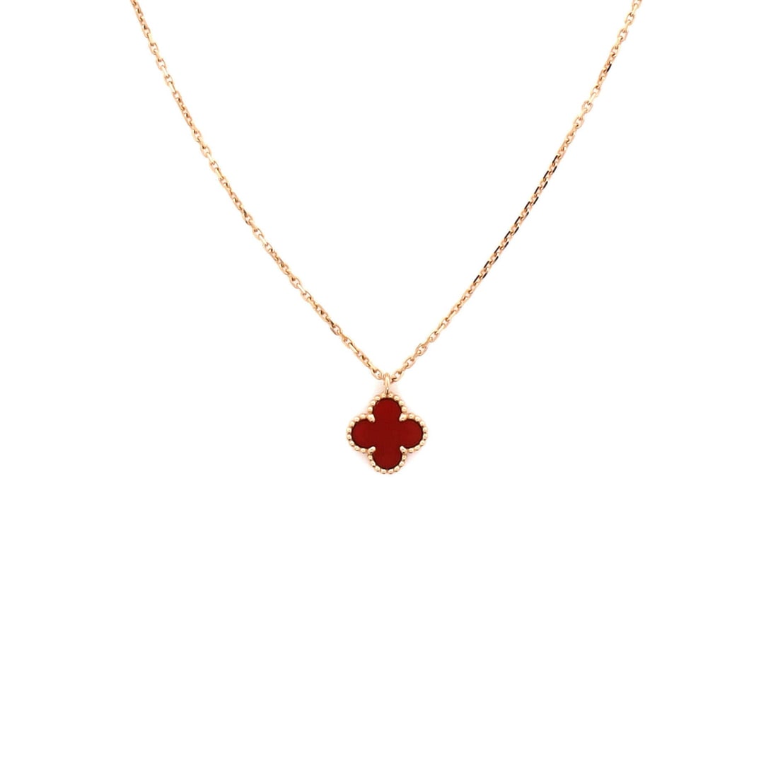 Van Cleef & Arpels Sweet Alhambra Pendant Necklace 18K Rose Gold and Carnelian: Built for the collarbone, the Van Cleef & Arpels Sweet Alhambra Pendant Necklace balances proportion with a piece-of-jewelry confidence. Worked in 18K Rose Gold and Carnelian. Its proportions slip cle
