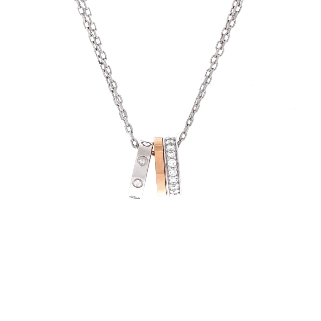 Cartier Love 3 Ring Pendant Necklace 18K Rose Gold and 18K White Gold with Diamonds: Editorial-calm, the Cartier Love 3 Ring Pendant Necklace reads as both ornament and quiet emblem. Worked in 18K Rose Gold and 18K White Gold with Diamonds. Scale-wise it lives in the sweet spot betwee