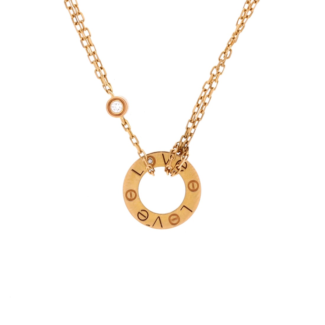 Cartier 2 Diamonds Love Pendant Necklace 18K Rose Gold and Diamonds: Tuned to wear, the Cartier 2 Diamonds Love Pendant Necklace keeps its silhouette spare and its presence assured. Worked in 18K Rose Gold and Diamonds. The drop sits exactly at the spot a thoughtful pi