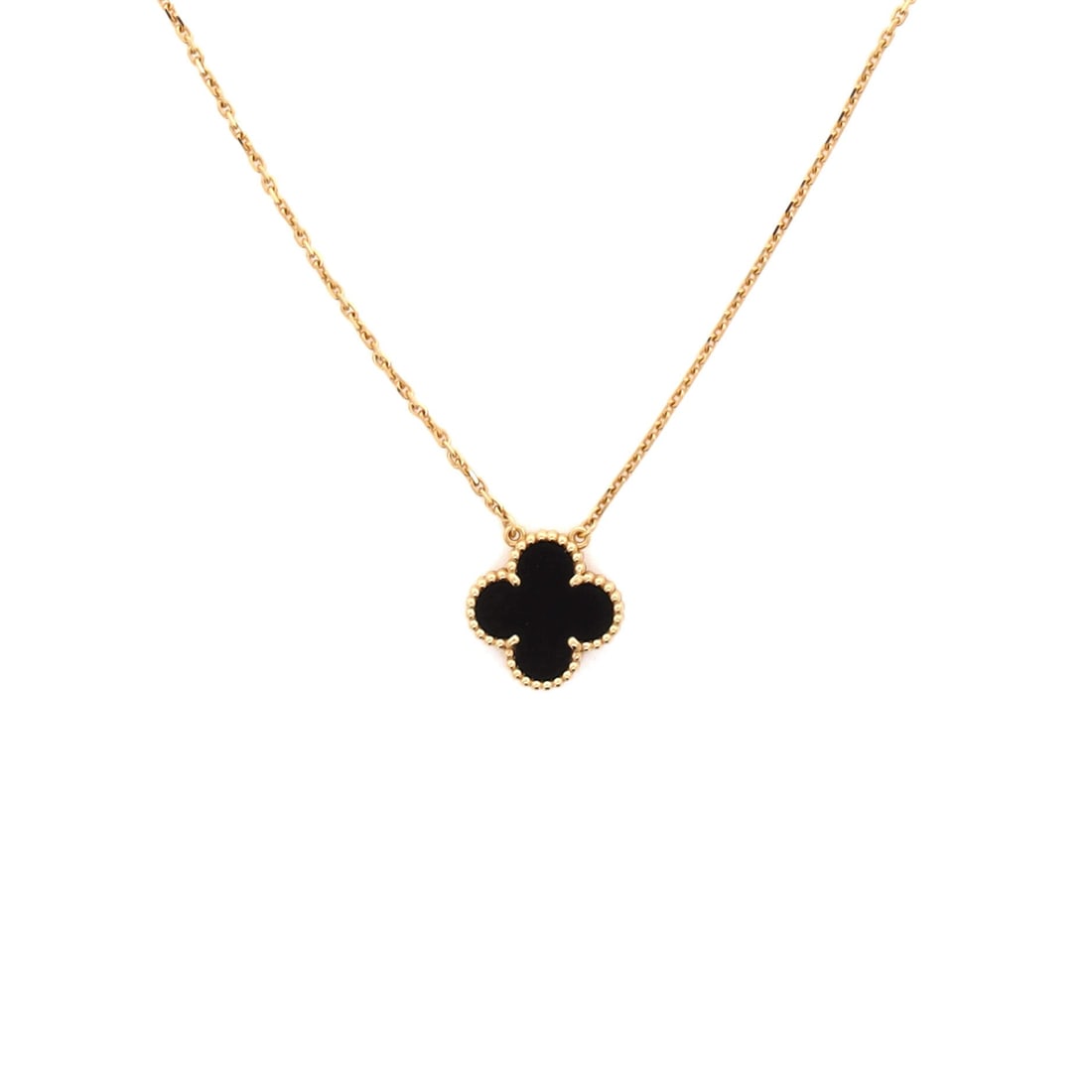 Van Cleef & Arpels Vintage Alhambra Pendant Necklace 18K Yellow Gold and Onyx: Architecturally restrained, the Van Cleef & Arpels Vintage Alhambra Pendant Necklace sits with elegant intent against the collarbone. Worked in 18K Yellow Gold and Onyx. The drop sits exactly at the s